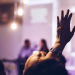 person raising hand